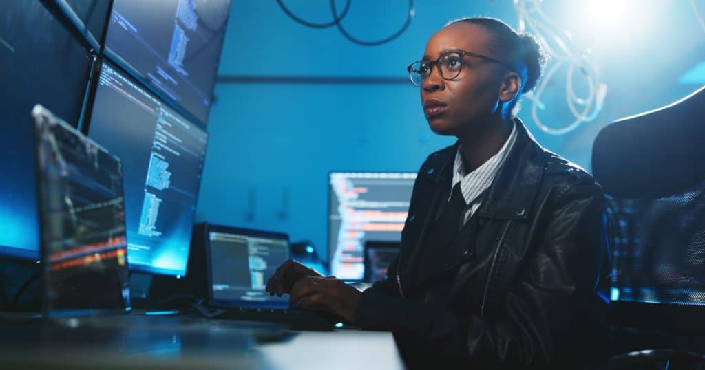 Fintech security professional managing payment data systems associated with traditional vaulted tokenization and PCI compliance