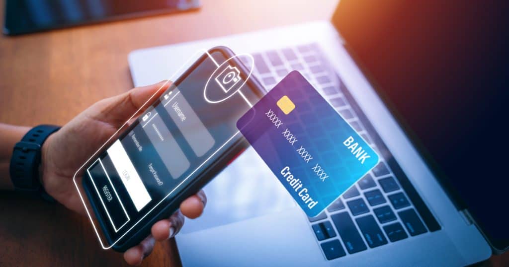 Mobile payment interface with digital credit card overlay, representing PCI scope reduction and secure tokenized payment architecture under PCI DSS 4.0.1.