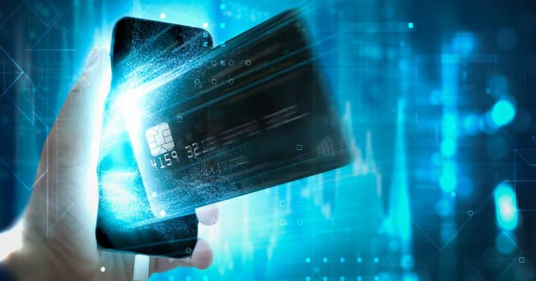 Digital credit card dissolving into light, representing elimination of stored cardholder data and PCI scope reduction through tokenization architecture.